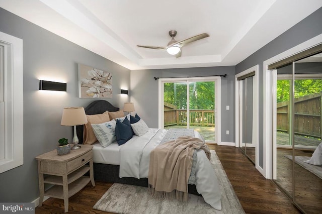 14906 Laurel Point Ln, Spotsylvania, VA 22551 - bedroom with a tray ceiling, access to outside, wood finished floors, and ceiling fan