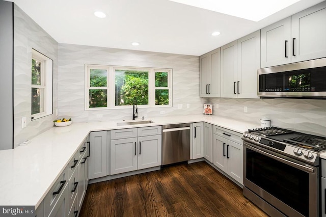 14906 Laurel Point Ln, Spotsylvania, VA 22551 - kitchen featuring stainless steel appliances, decorative backsplash, light countertops, recessed lighting, and dark wood-style floors