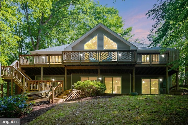 14906 Laurel Point Ln, Spotsylvania, VA 22551 - back of house at dusk featuring a wooden deck and stairs