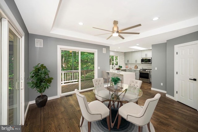 14906 Laurel Point Ln, Spotsylvania, VA 22551 - dining area featuring a ceiling fan, a raised ceiling, dark wood finished floors, and recessed lighting