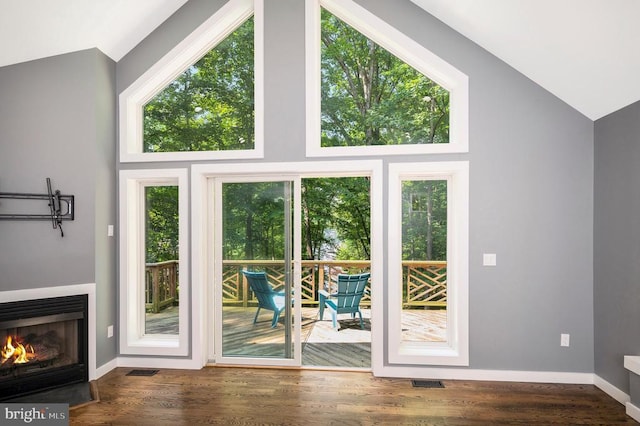 14906 Laurel Point Ln, Spotsylvania, VA 22551 - entryway with vaulted ceiling, a warm lit fireplace, and wood finished floors