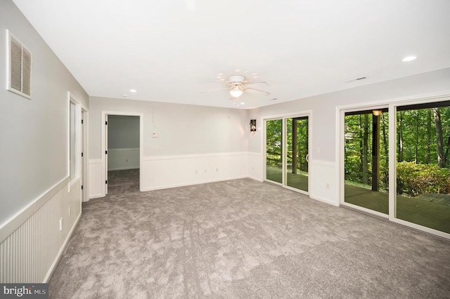 14906 Laurel Point Ln, Spotsylvania, VA 22551 - carpeted empty room featuring a ceiling fan, wainscoting, and recessed lighting