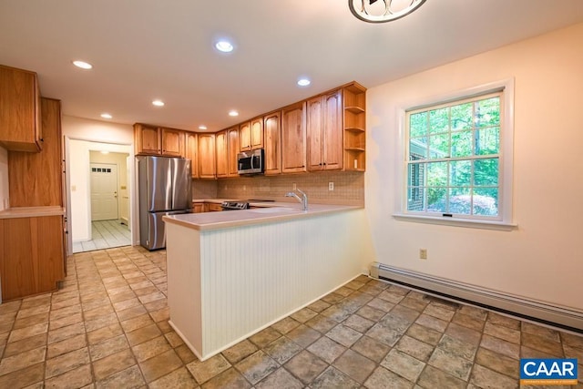 18220 Gregory Dr, Gordonsville, VA 22942 - kitchen featuring a baseboard radiator, a peninsula, open shelves, tasteful backsplash, and appliances with stainless steel finishes