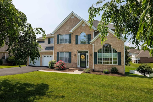 15 Brookmere Ct, Staunton, VA 24401 - view of front of home with asphalt driveway, brick siding, a front yard, and an attached garage