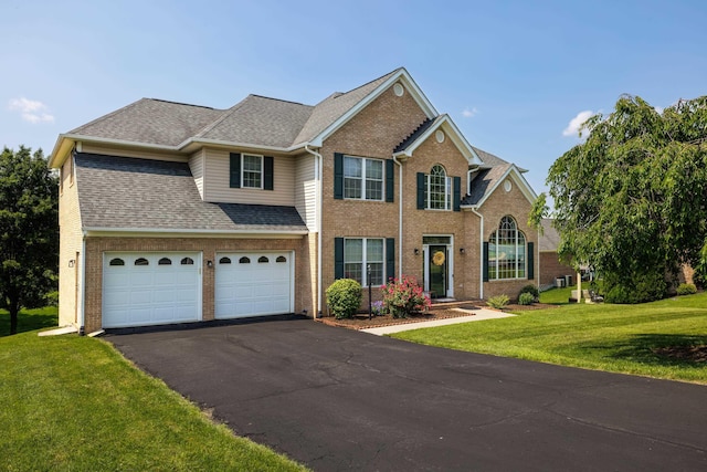 15 Brookmere Ct, Staunton, VA 24401 - view of front of home featuring driveway, brick siding, a front lawn, and roof with shingles