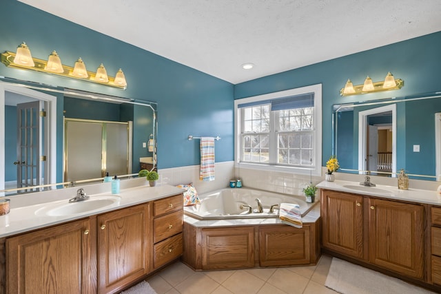 15 Brookmere Ct, Staunton, VA 24401 - full bathroom featuring two vanities, a stall shower, a whirlpool tub, and tile patterned floors