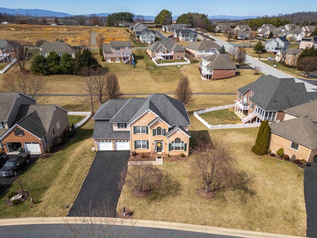 aerial view of residential area featuring a mountain backdrop