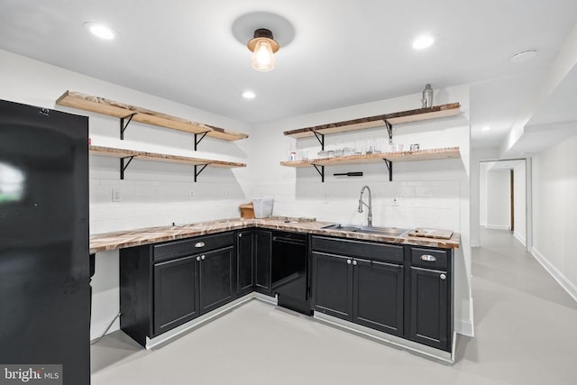  - kitchen with open shelves, dark cabinets, butcher block counters, black dishwasher, and recessed lighting