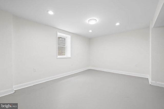  - spare room featuring recessed lighting and concrete flooring