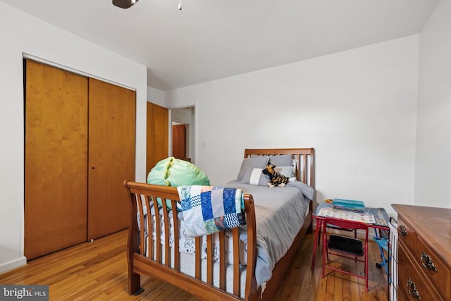  - bedroom featuring light wood-style flooring and a closet