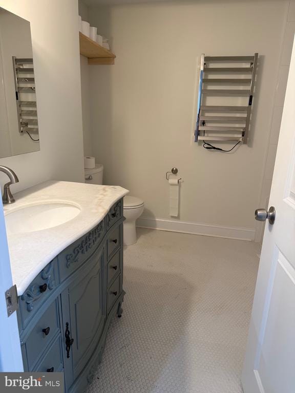  - bathroom featuring toilet and vanity