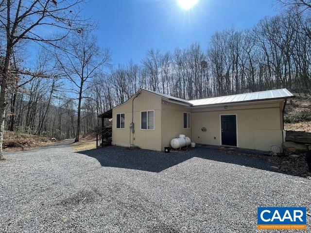 1308 Spruce St, Monterey, VA 24465 - back of house featuring metal roof and gravel driveway