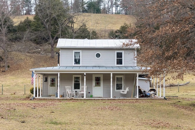 15745 Runions Creek Rd, Broadway, VA 22815 - farmhouse inspired home featuring metal roof, a front lawn, a standing seam roof, and a porch