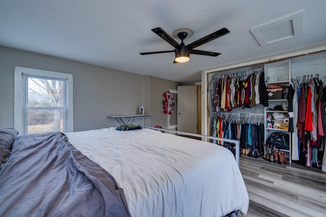 15745 Runions Creek Rd, Broadway, VA 22815 - bedroom with a closet, wood finished floors, attic access, visible vents, and ceiling fan