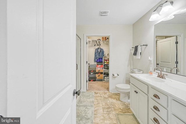 307 Cardinal, Louisa, VA 23093 - bathroom with vanity, a walk in closet, and a shower stall