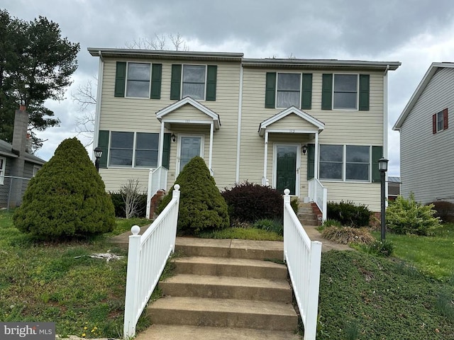 view of front of home with fence