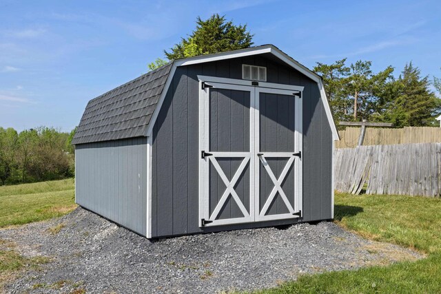 view of shed with fence