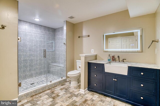11400 Alvin Ln, Culpeper, VA 22701 - full bathroom featuring a stall shower, vanity, and wood finished floors