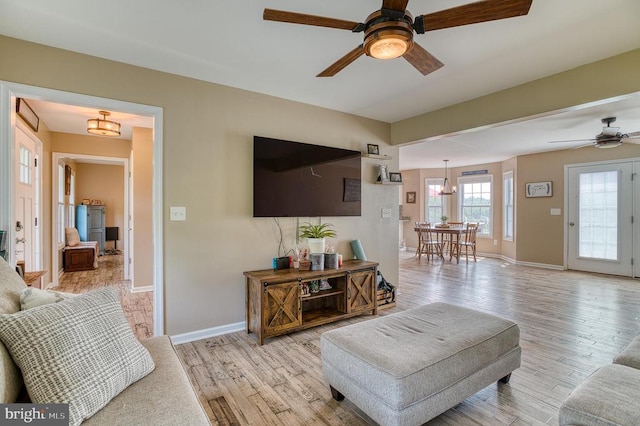 11400 Alvin Ln, Culpeper, VA 22701 - living area featuring ceiling fan, light wood finished floors, and a chandelier
