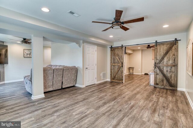 11400 Alvin Ln, Culpeper, VA 22701 - below grade area featuring a barn door, ceiling fan, wood finished floors, and recessed lighting