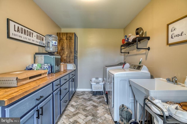 11400 Alvin Ln, Culpeper, VA 22701 - washroom featuring cabinet space, washing machine and dryer, and brick patterned floors