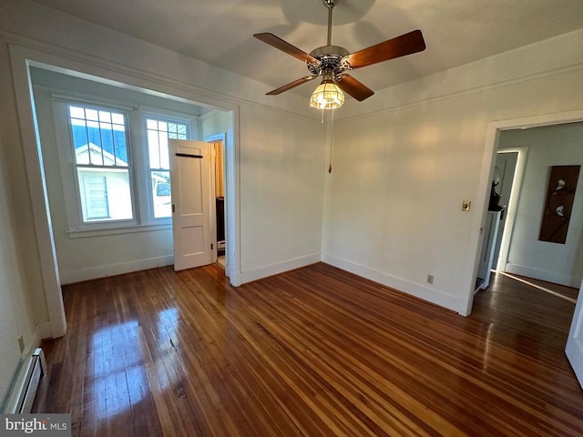 empty room featuring a baseboard radiator, wood-type flooring, a ceiling fan, and baseboards