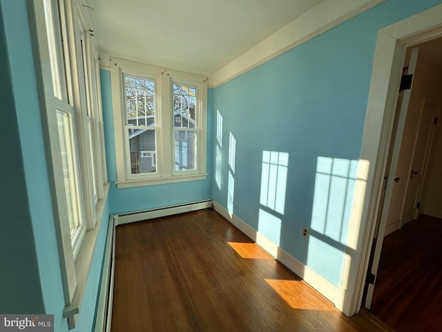 unfurnished sunroom featuring a baseboard radiator