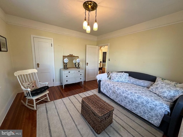 living room featuring wood finished floors and baseboards