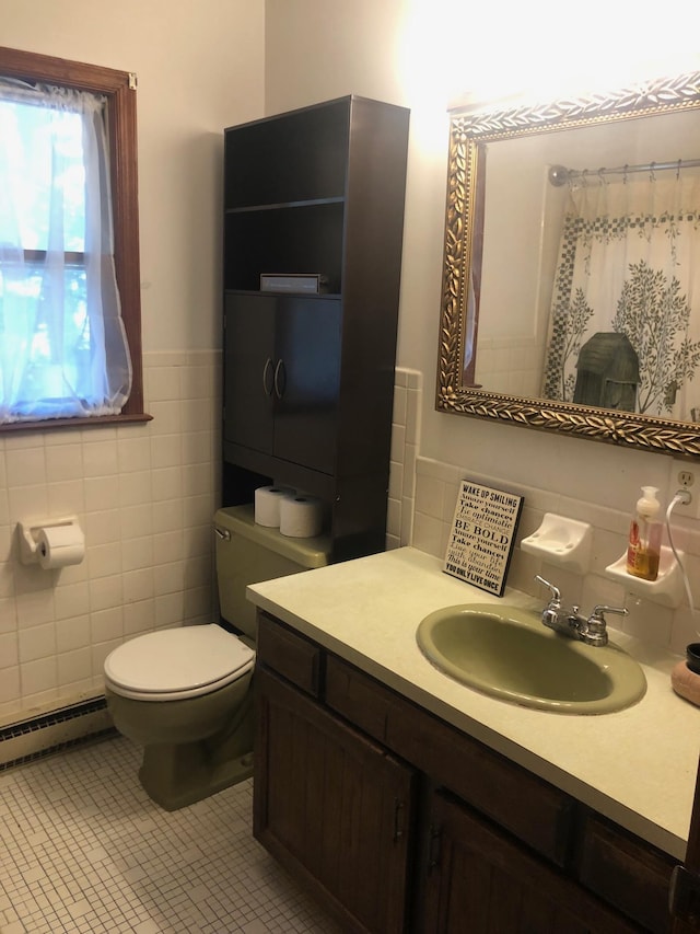 109 Cooper Dr, Stuarts Draft, VA 24477 - full bathroom featuring tile walls, a baseboard radiator, vanity, wainscoting, and a shower with shower curtain