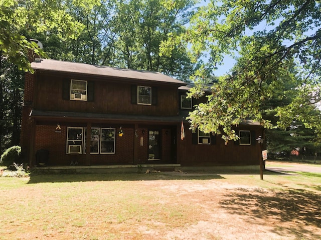 109 Cooper Dr, Stuarts Draft, VA 24477 - traditional-style house featuring covered porch, a chimney, and a front lawn