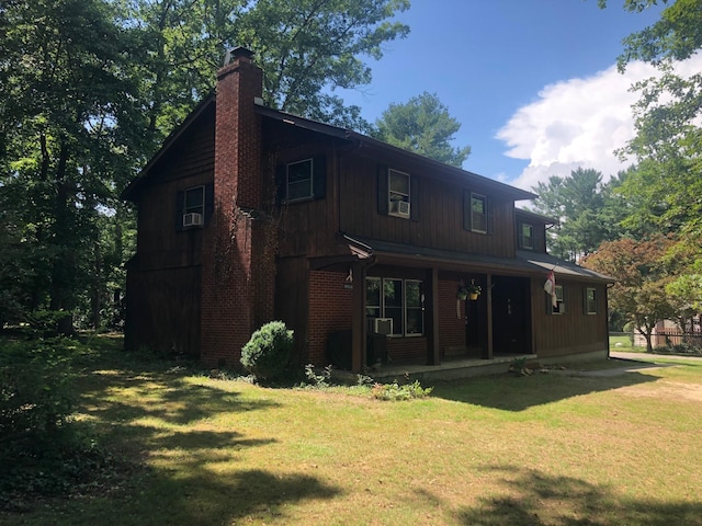 109 Cooper Dr, Stuarts Draft, VA 24477 - rear view of property with covered porch, a chimney, a lawn, and cooling unit