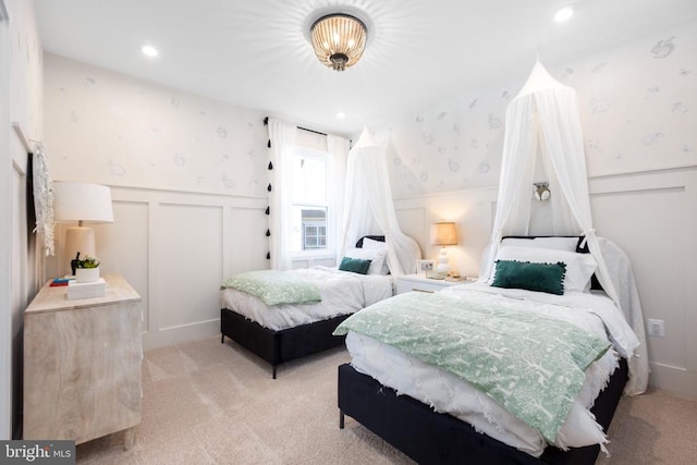 10103 N Streamview Ct, Fredericksburg, VA 22408 - bedroom with a decorative wall, wallpapered walls, wainscoting, and light carpet