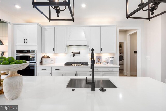 10103 N Streamview Ct, Fredericksburg, VA 22408 - kitchen with custom exhaust hood, a sink, stainless steel appliances, light countertops, and recessed lighting
