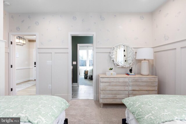 10103 N Streamview Ct, Fredericksburg, VA 22408 - carpeted bedroom with a decorative wall, wallpapered walls, and wainscoting