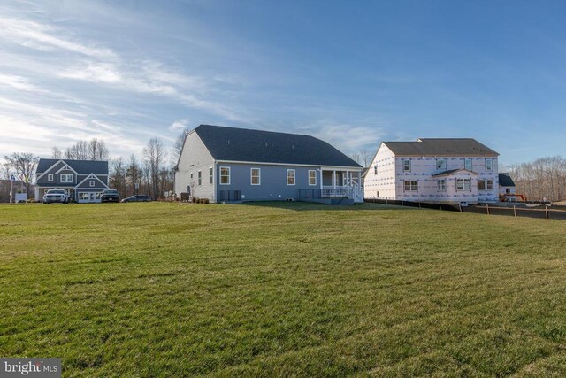 10103 N Streamview Ct, Fredericksburg, VA 22408 - back of property featuring a lawn and central AC