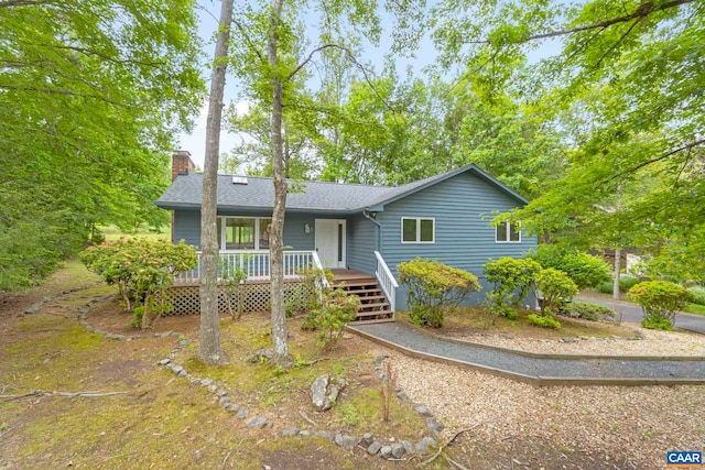 7 Spoon Ter, Palmyra, VA 22963 - ranch-style house featuring a chimney, roof with shingles, and a deck