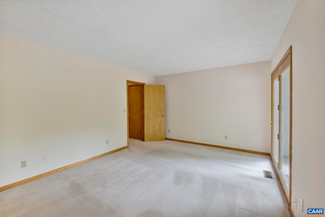 7 Spoon Ter, Palmyra, VA 22963 - empty room featuring a textured ceiling and light carpet