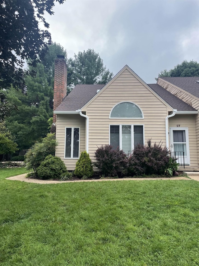 27 Shannon Pl Unit 27, Staunton, VA 24401 - view of front facade with a chimney, a front yard, and roof with shingles