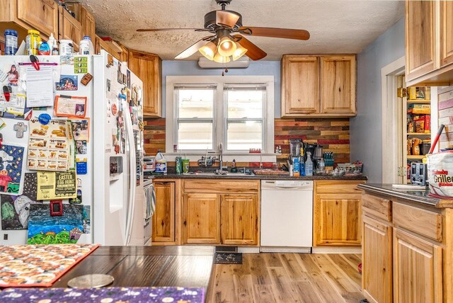 202 Jackson Ave, Elkton, VA 22827 - kitchen with white appliances, a sink, a ceiling fan, light wood finished floors, and dark countertops