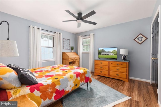  - bedroom featuring wood finished floors and ceiling fan