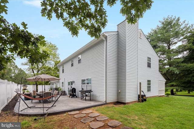  - back of property with a patio and a chimney