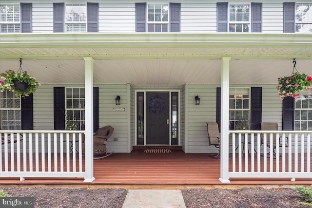  - property entrance featuring a porch