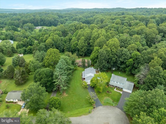 - drone / aerial view of a heavily wooded area
