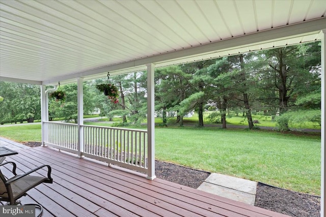  - wooden terrace featuring a yard