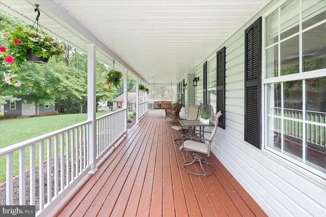  - wooden porch with a lawn