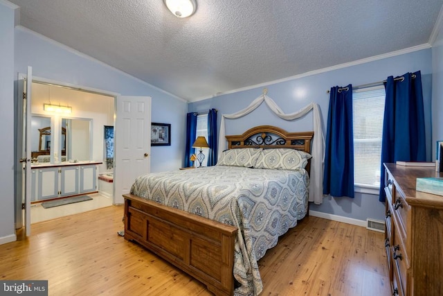 400 Fork River Rd N, Shenandoah, VA 22849 - bedroom featuring ornamental molding, light wood-style floors, vaulted ceiling, a textured ceiling, and ensuite bathroom
