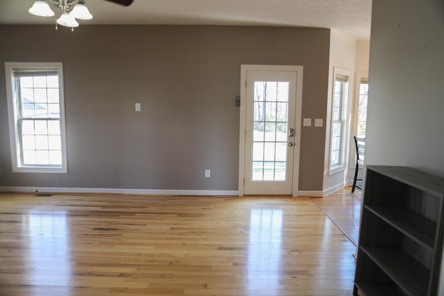 182 Henkel Rd, Waynesboro, VA 22980 - unfurnished living room with light wood-type flooring, baseboards, and a ceiling fan