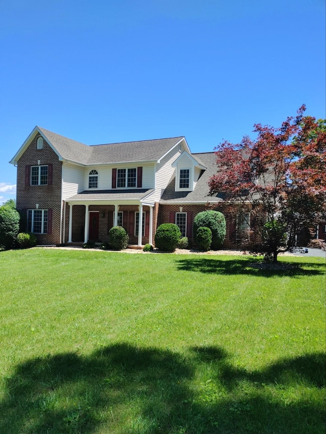 182 Henkel Rd, Waynesboro, VA 22980 - traditional home with brick siding, a front lawn, covered porch, and roof with shingles