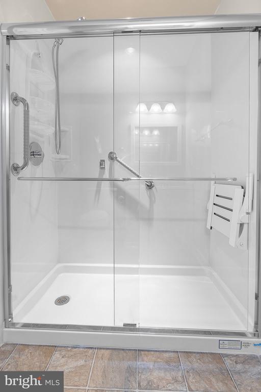  - full bathroom with a stall shower