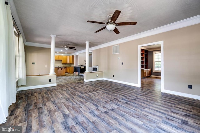 369 Eldon Yates Dr, Stanley, VA 22851 - unfurnished living room featuring decorative columns, a ceiling fan, crown molding, dark wood-style floors, and a textured ceiling